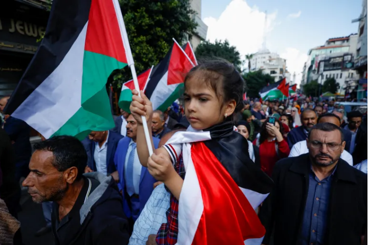 Palestinians in Ramallah, West Bank, demonstrate in solidarity with Gaza, 15 October 2023 [Mohammed Torokman/Reuters]